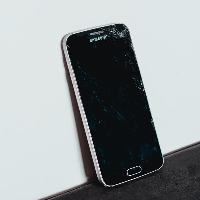 cracked Samsung screen, displaying significant damage with visible fractures, affecting the screen's clarity and functionality.